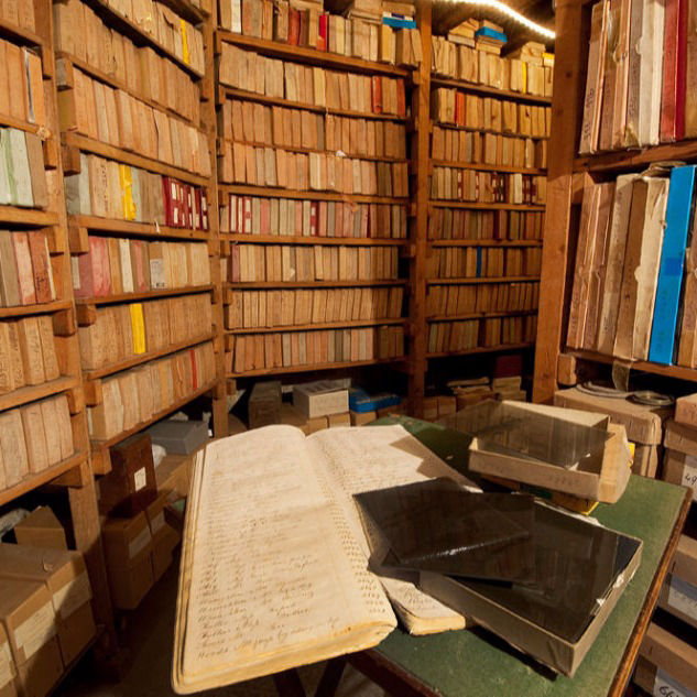 Edward Reeves archive negative room showing ledgers & glass plates in foreground